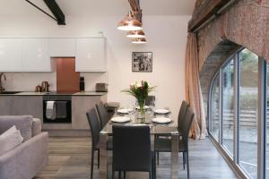 a kitchen and dining room with a table and chairs at Strawberry Line, Apartment 1 in Wells