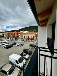 a parking lot with cars parked in a parking lot at Apartamentos centro I.II in El Barraco