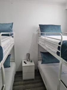 Una cama o camas en una habitación de Mikaela Guest House