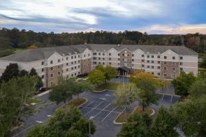 an aerial view of a building with a parking lot at Staybridge Suites Tallahassee I-10 East, an IHG Hotel in Tallahassee