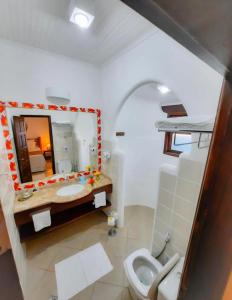 Ванна кімната в Pousada Villa Cumuru