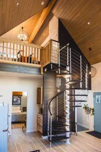 a spiral staircase in a living room in a house at The Sol Cottage+ Hiking+Creek Access+Views in Sedona