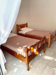 Postel nebo postele na pokoji v ubytování Crete Joy