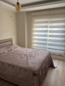 Posteľ alebo postele v izbe v ubytovaní Antalia konyalt Sarisu