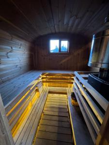 an inside view of a wooden cabin with a window at Just Like Home Bed & Spa Porsgrunn in Porsgrunn