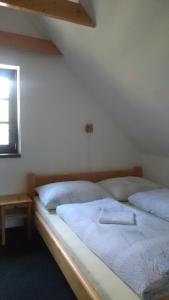 Postel nebo postele na pokoji v ubytování A&B Bungalovy