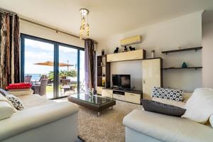 Et opholdsområde på Villa Alex,pool and ocean view