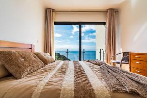 En eller flere senge i et værelse på Villa Alex,pool and ocean view + 61 billeder