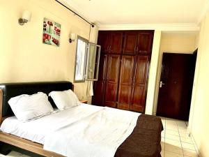 Cama o camas de una habitación en Appart 3 Ch. Biteng Yaoundé