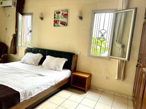 Postel nebo postele na pokoji v ubytování Appart 3 Ch. Biteng Yaoundé