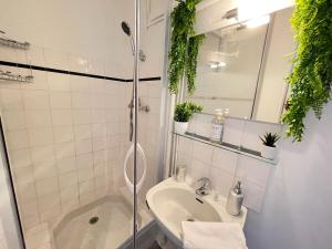 a bathroom with a shower and a sink at Little Good time in Marseille