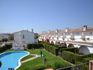 a view of the courtyard of a building with a swimming pool at Casa con Piscina y Cerca de la Playa en L'Estartit - ES-323-65 in L'Estartit +5 photos
