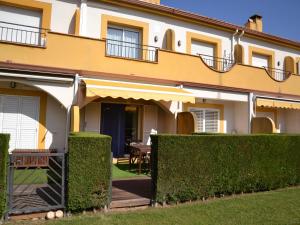 a building with a table and chairs in the yard at Casa con Piscina, Cerca de la Playa y del Centro - L'Estartit - ES-323-32 in L'Estartit
