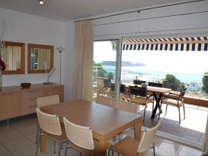 a kitchen and dining room with a table and chairs at Casa Mediterranea - L'Estartit, Roca Maura - ES-323-70 in L'Estartit
