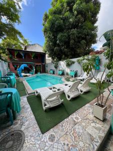 a group of chairs and a swimming pool at Ladeira de Olinda in Olinda
