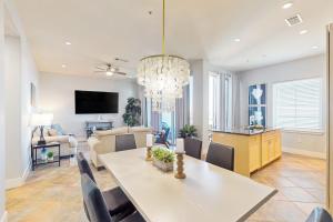 a dining room and living room with a dining table at Diamond Beach Resort: Galveston Gem #514 in Galveston