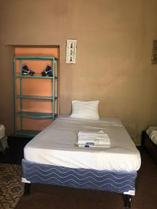 Ein Bett oder Betten in einem Zimmer der Unterkunft Hotel Brunette