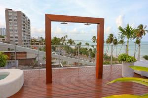 a balcony with a view of the ocean at Setai Yacht Premium - By Almare Flats in João Pessoa