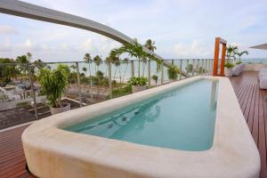 a swimming pool on the balcony of a hotel at Setai Yacht Premium - By Almare Flats in João Pessoa