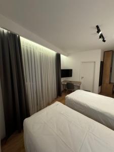 Letto o letti in una camera di Triangle Rooms