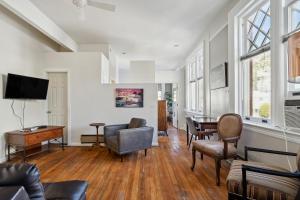 a living room filled with furniture and a flat screen tv at THE CARRICK in Bisbee