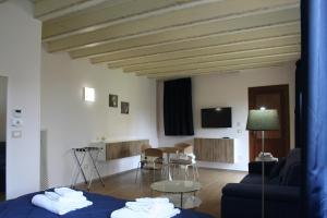a living room with a couch and a table at Bamboo Luxury Agrigento in Agrigento