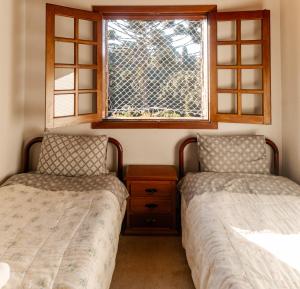 Ein Bett oder Betten in einem Zimmer der Unterkunft Apartamento amplo em Campos do Jordão