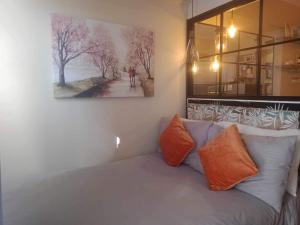 a painting hanging on a wall next to a couch at AVIDA ATRIA Tower 3 in Iloilo City +26 photos