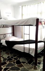 Ένα ή περισσότερα κρεβάτια σε δωμάτιο στο Alojamiento cómodo en el centro de la ciudad.