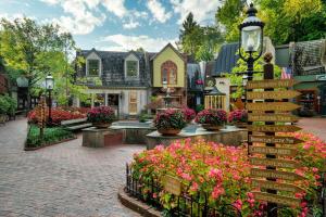 a group of houses with flowers on a street at Couples Getaway Hot Tub & Mountain View in Sevierville