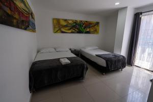 Postel nebo postele na pokoji v ubytování Hotel Tayromar