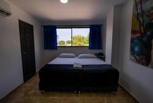 Postel nebo postele na pokoji v ubytování Hotel Tayromar