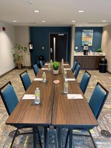 a conference room with a long wooden table and chairs at Hampton Inn Harrisburg-East/Hershey in Harrisburg