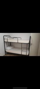 a shelf in a room with white towels on it at Cityapartment12 bei Hauptbahnhof in Bremen
