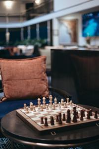 a chess board sitting on top of a table at Ramada by Wyndham Diplomat Canberra in Canberra