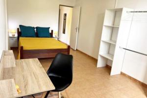 Letto o letti in una camera di appartement entier en Martinique Le Khan