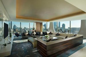 a living room with a view of a city at Conrad Beijing by Hilton in Beijing