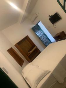 Ein Bett oder Betten in einem Zimmer der Unterkunft Pousada da Rita