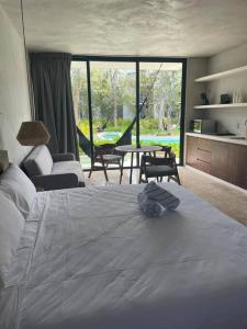 Ένα ή περισσότερα κρεβάτια σε δωμάτιο στο Tulum Sweet Condo with private pool