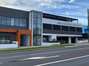 a building with an amazon powered companies sign on it at Amica Serviced Apartments in Orange