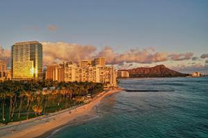 a view of a beach with buildings and the ocean at Ka La'i Waikiki Beach, LXR Hotels & Resorts in Honolulu