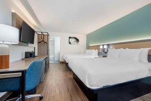 เตียงในห้องที่ Comfort Inn Sea World Area