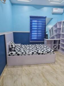 a bedroom with a bed in a room at Prime PH Home in Port Harcourt