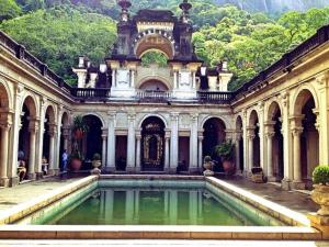 a building with a pool of water in front of it at RIO DE JANEIRO Hostel in Rio de Janeiro