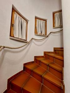 a staircase in a church with two windows at Ferienwohnung Vesna & Alex in Elmen