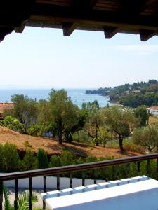 a view of the ocean from a balcony at Villa Anna Maria in Agia Paraskevi