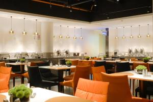 Restoran või mõni muu söögikoht majutusasutuses Paco Hotel Beijing Road Tuan Yi Da Metro Guangzhou