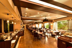 a restaurant with tables and chairs in a room at The Prince Hakone Lake Ashinoko in Hakone +69 photos