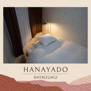 Postel nebo postele na pokoji v ubytování 花宿新宿 HANAYADO SHINJUKU