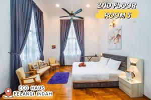 a bedroom with a bed and a living room at ECOHAUs AeonTebrau/Pool/Netflix/Karaoke/Gaming in Ulu Tiram